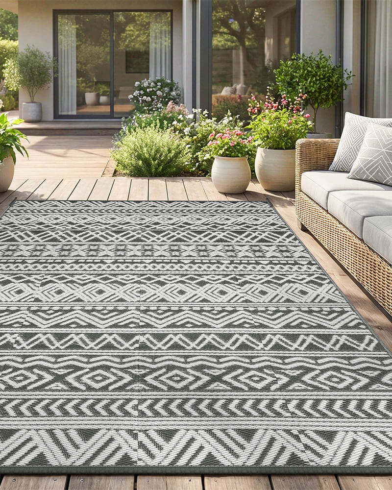 boho-plastic-straw-outdoor-rug-gray-outside
