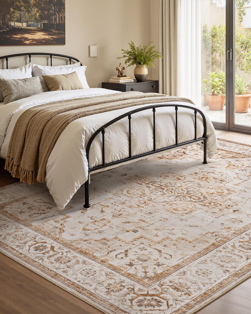 sylva-washable-area-rug-beige-in-bedroom