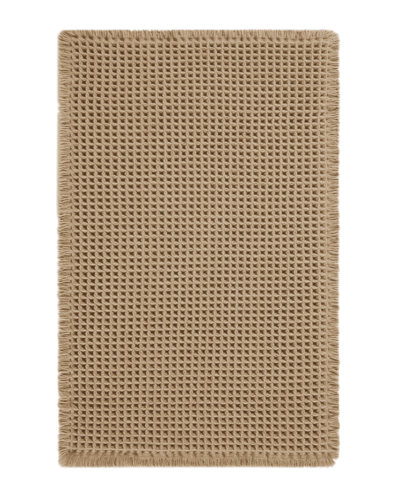 waffle-texture-bath-mat-with-tassels Waffle texture bath mat with decorative tassels, designed to absorb moisture quickly while adding warmth to bathroom décor
